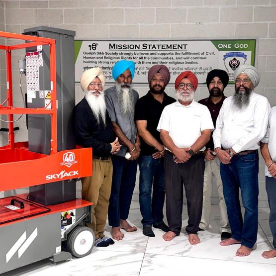 Guelph Sikh Society members with an SJ20 E vertical mast