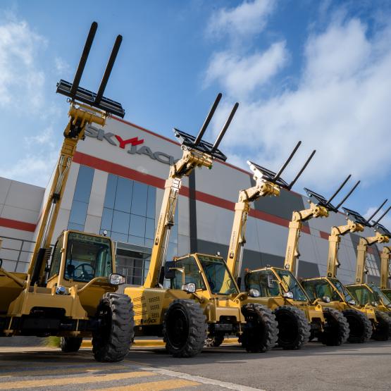 SJ519 TH telehandlers painted gold and lined up outside Skyjack's Mexico facility.