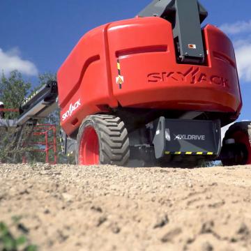 SJ60 AJ+ machine rolling over a sandy hill